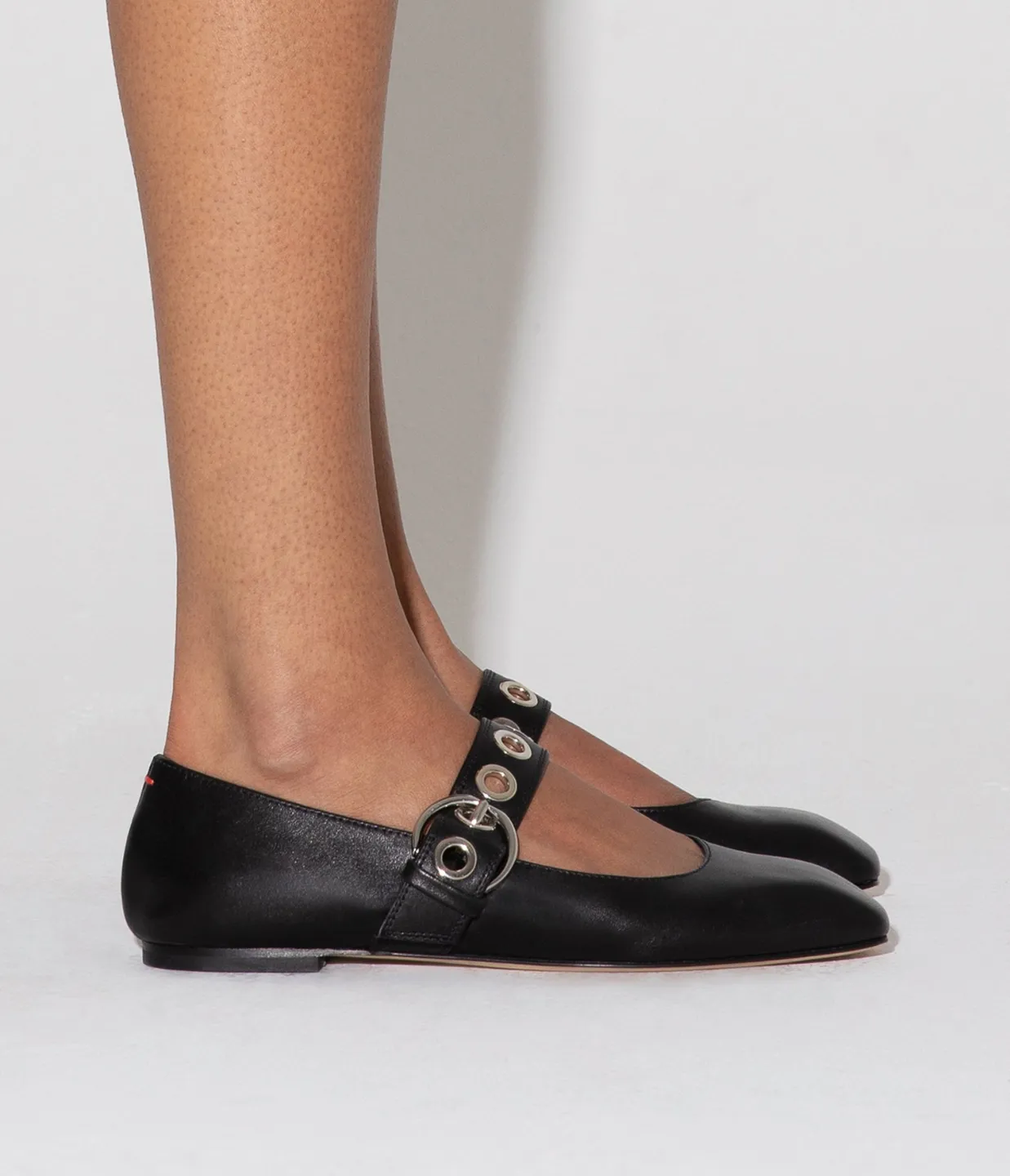 Uma Eyelet Leather Flat in Black